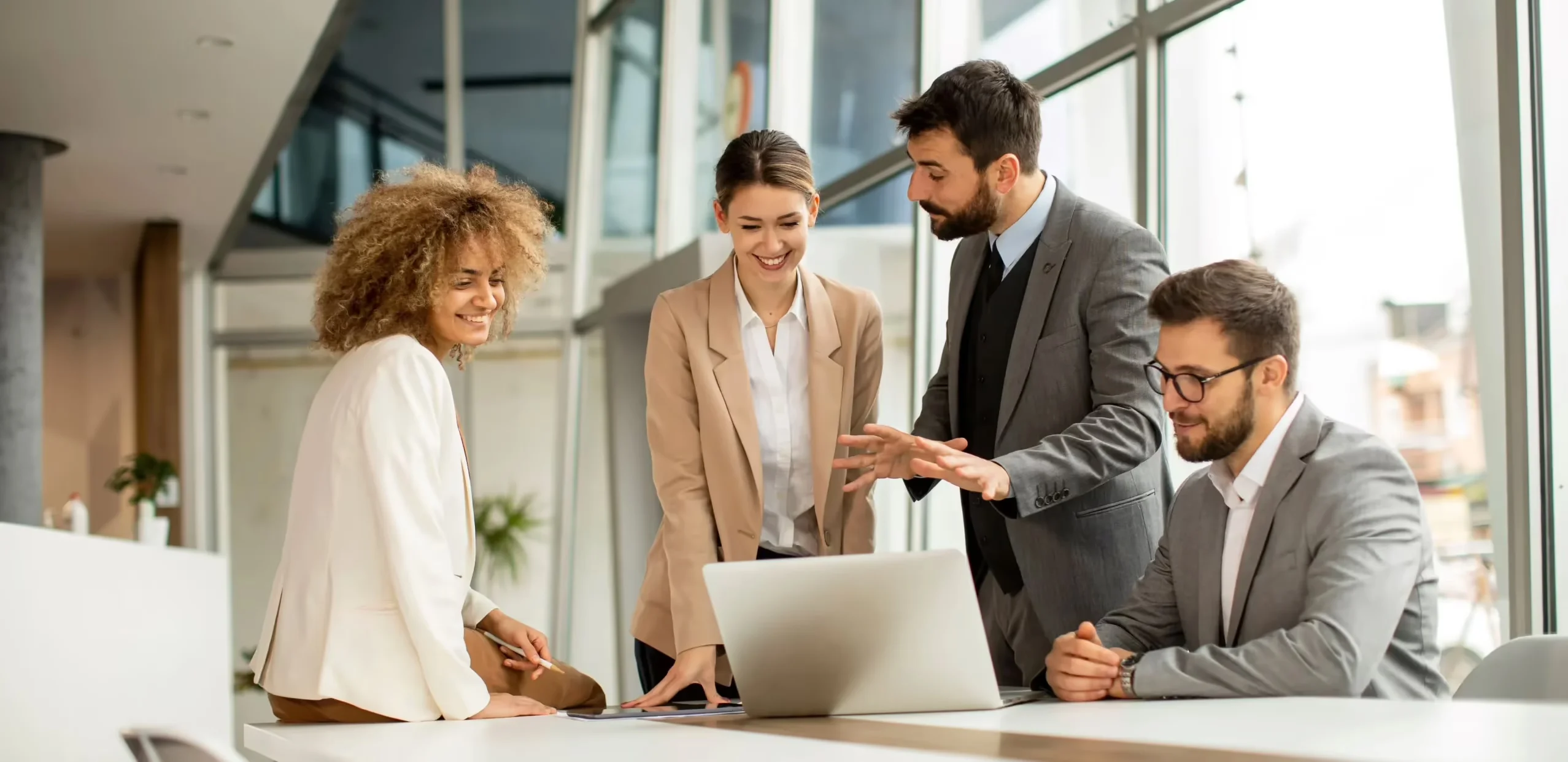 Two businessmen and two businesswomen having a meeting